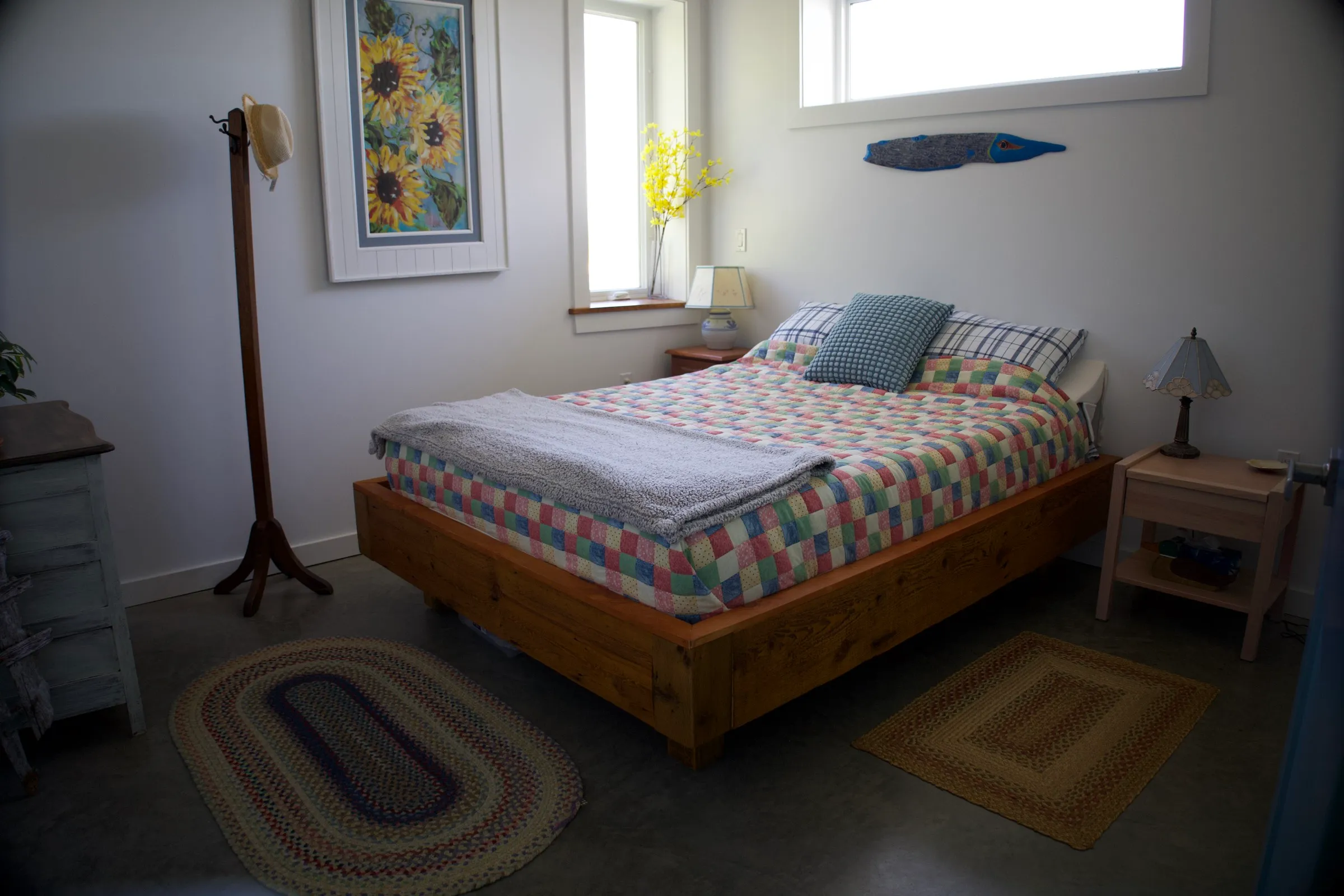 Main bedroom with a queen bed in calm coastal tones