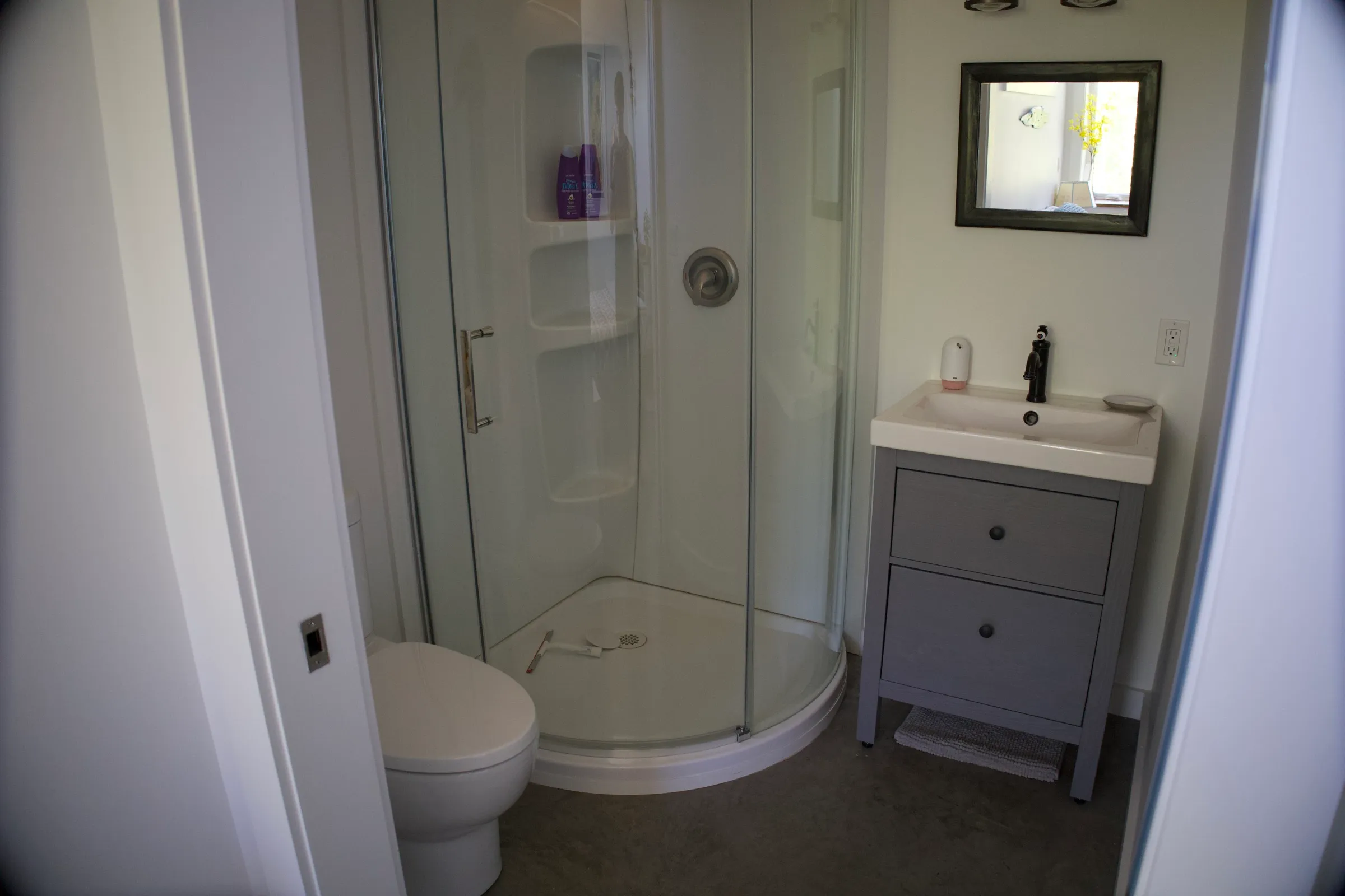 En-suite bathroom with vanity and mirror
