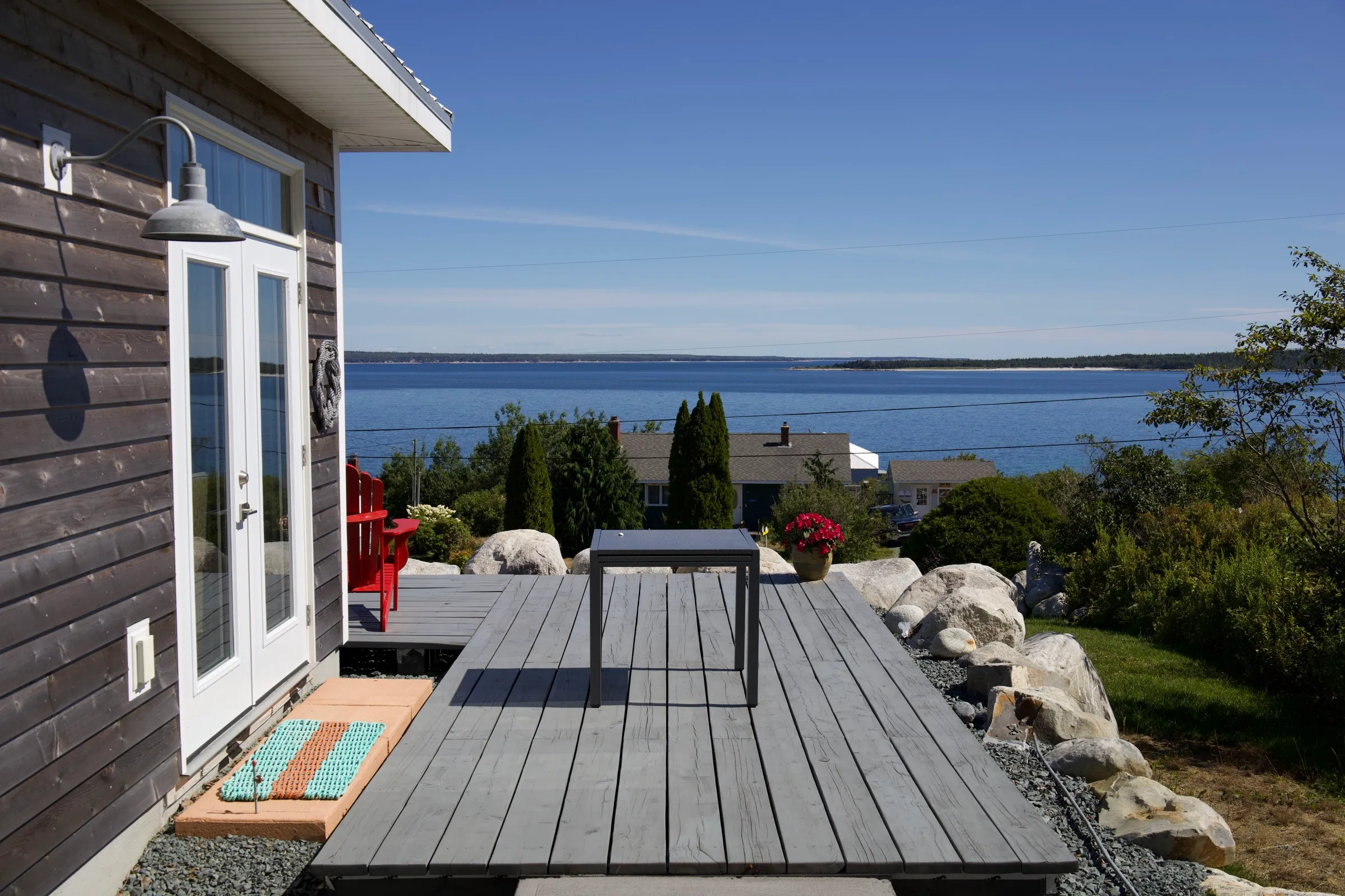 Side deck of the cottage in afternoon light
