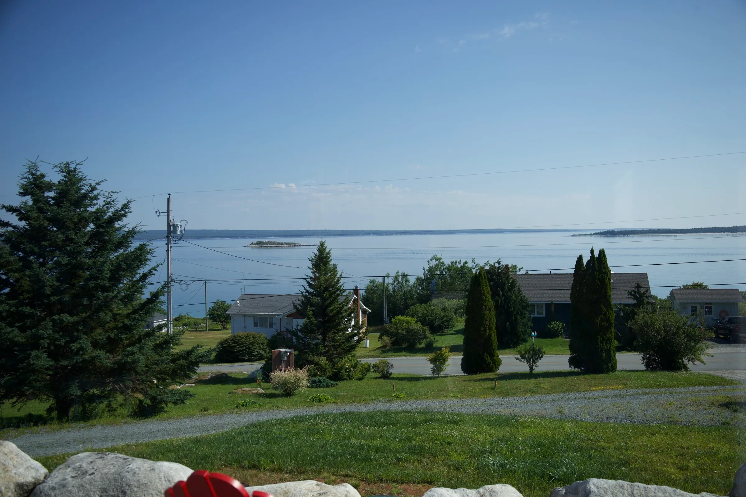 View over Port Mouton bay from the cottage grounds, with an island offshore